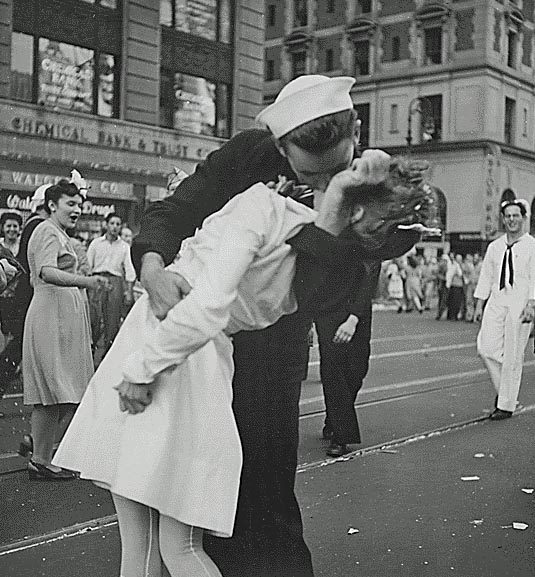 New York City celebrating the surrender of Japan. They threw anything and kissed anybody in Times Square., 08/14/1945. Credit: National Archives.