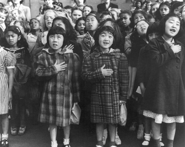 San Francisco, Calif., April 1942 - Children of the Weill public school, from the so-called international settlement, shown in a flag pledge ceremony. Some of them are evacuees of Japanese ancestry who will be housed in War relocation authority centers for the duration (Library of Congress)