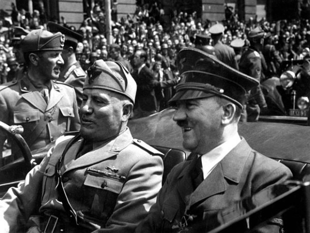 Hitler (r) and Mussolini (l) ca. June 1940. Part of Eva Braun's Photo Albums, ca. 1913 - ca. 1944, seized by the U.S. government. This image is available from the Online Public Access (OPA) of the United States National Archives and Records Administration under the National Archives Identifier 540151. (Source: National Archives.